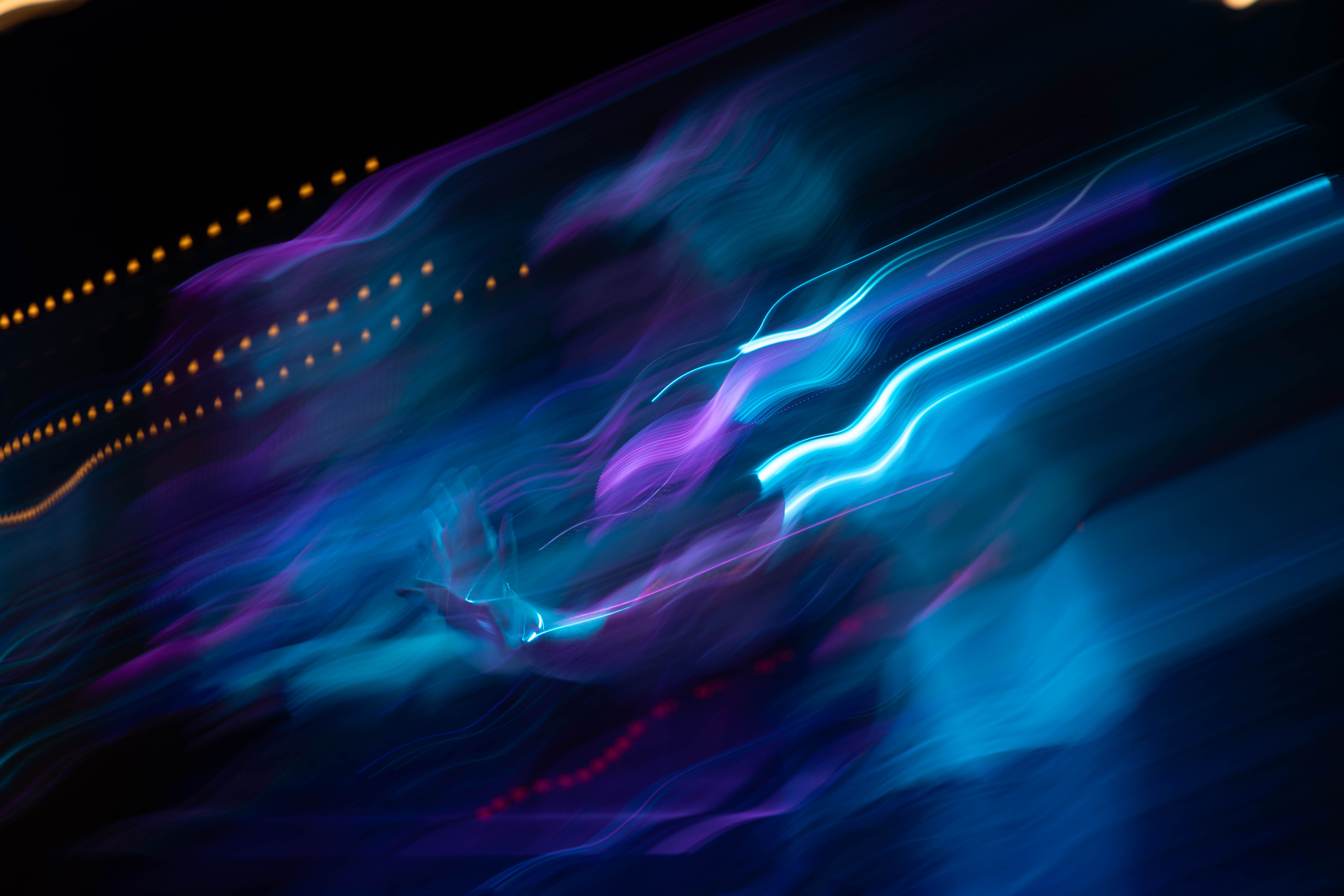 image of a band performing with trails of light